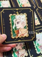 Dcst Stamp 1.0 Enamel Pin in hand